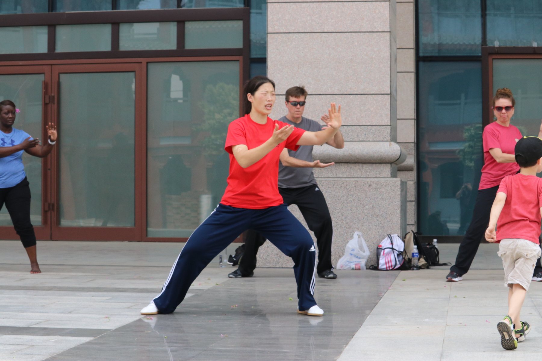 Master Chen Huixian teaching a Chen Taijiquan movement outdoors in Chenjiagou